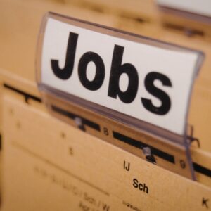Close-up of a filing cabinet drawer with a white sign reading 'Jobs'.